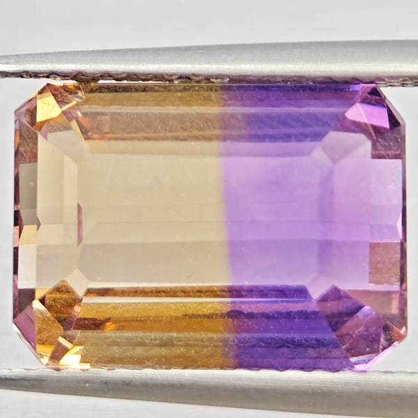 Natural Bi Color Ametrine 7.43 Ct. VVS Octagon Shape 12.8 x 9.5 Mm. Gemstone From Bolivia: Product ID: 800408626 Product Name: Natural Ametrine Weight: 7.43 CT. Size: 12.8 x 9.5 x 7.2 MM. Shape: Octagon Color: Bi Color Clarity:VVS Luster: Good Gems Origin: Bolivia Treatment: Unheated Crysta