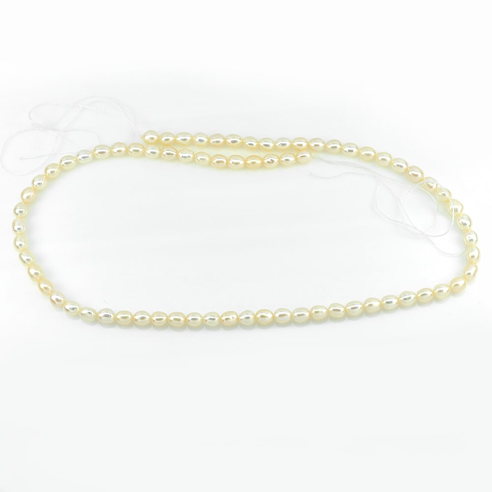 Natural Peach Pink Pearl Beads Strand 48.68 Ct. Length 14.5 Inch.: Product ID: 805206358 Product Name: Natural Pearl Weight: 48.68 CT. Size: 14.5 Inch. 5 x 4 MM. Shape: Fancy Cabochon Color: Pink Clarity:Opaque Luster: Strong Iridescent Gems Origin: China Treatment: