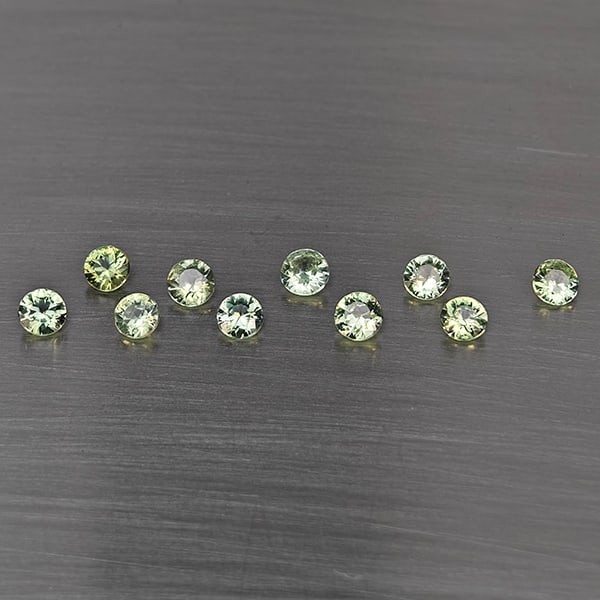 Natural Green Songea Sapphire 1.20 Ct. 10 Pcs Round Diamond Cut 3 Mm Gemstone from Tanzania: Product ID: 806130513 Product Name: Natural Blue Sapphire Weight: 1.20 CT. Size: 3 x 3 x 1.8 MM. Shape: Round Diamond Cut Color: Green Clarity:SI1 Luster: Good Gems Origin: Tanzania Treatment: Heated