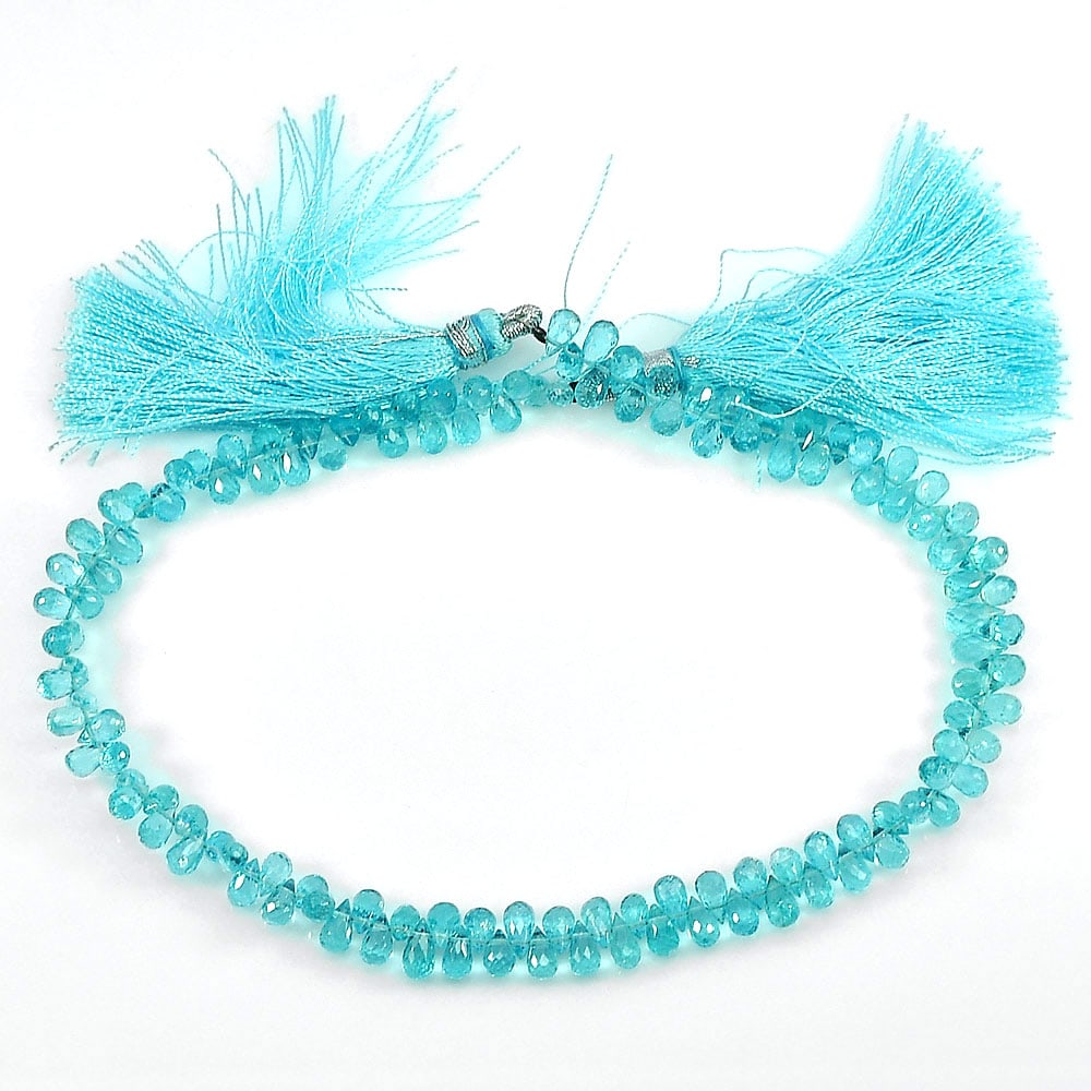 Natural Paraiba Color Apatite 58.85 Ct. Briolette With Drilled Beads Length 10 Inch: Product ID: 800607722 Product Name: Natural Apatite Weight: 58.85 CT. Size: 10 Inch. / 5.6 x 3.4 MM. Shape: Briolette With Drilled Color: Blue Clarity:IF - VVS Luster: Good Gems Origin: Tanzania Treat