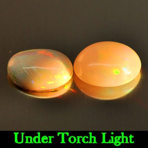 Natural Multi Color Play Of Colour Opal 1.24 Ct. 2 Pcs Oval Cabochon Shape 8.1 x 6.2 Mm Gemstone: Product ID: 818725440 Product Name: Natural Opal Weight: 1.24 CT. Size: 8.1 x 6.2 x 3.5 MM. Shape: Oval Cabochon Color: Multi Color Clarity:Semi - Transparent Luster: Iridescent Gems Origin: Ethiopia