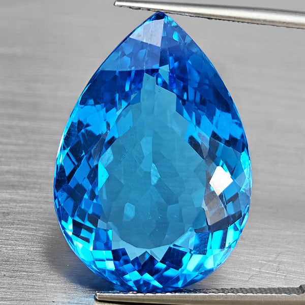 Natural Swiss Blue Topaz 36.49 Ct. Pear Shape 25 x 17.8 Mm Gemstone From Brazil: Product ID: 807168695 Product Name: Natural Blue Topaz Weight: 36.49 CT. Size: 25 x 17.8 x 10.4 MM. Shape: Pear Shape Color: Swiss Blue Clarity:VVS Luster: Good Gems Origin: Brazil Treatment: Treated