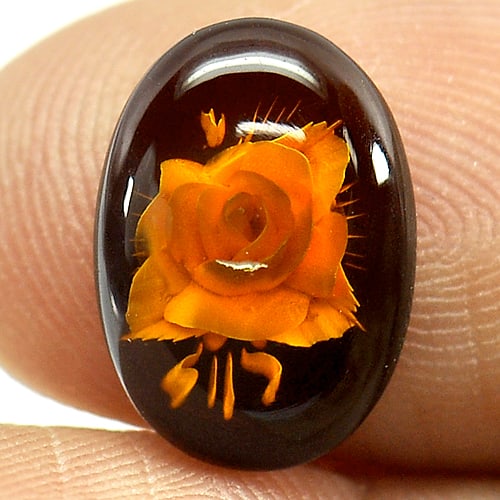 Natural Brown Yellow Amber 1.18 Ct. Flower Carving In Oval Cabochon Shape 13.3 x 9.4 Mm Gemstone: Product ID: 819003510 Product Name: Natural Amber Weight: 1.18 CT. Size: 13.3 x 9.4 x 3.3 MM. Shape: Oval Cabochon Color: Brown Yellow Clarity:Semi - Transparent Luster: Good Gems Origin: Poland Treat