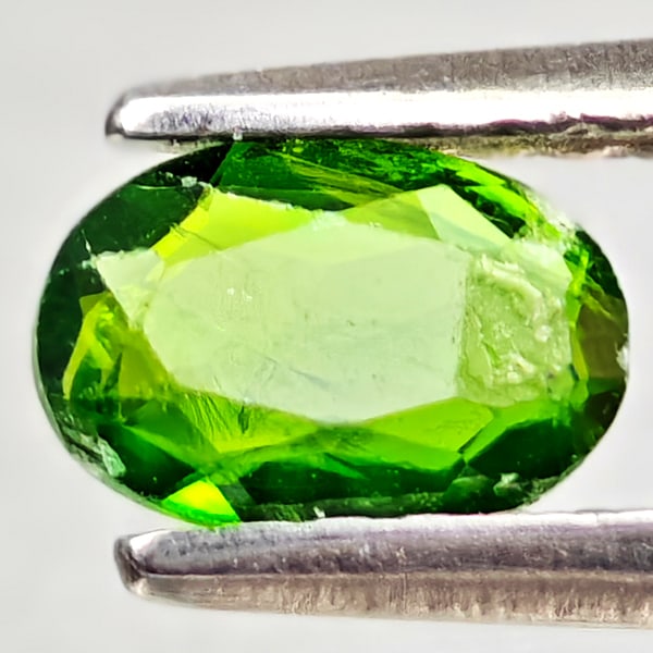 Natural Green Chrome Diopside 0.43 Ct. Oval Shape 6.1 x 4.2 Mm Gemstone from Russia: Product ID: 801608159 Product Name: Natural Chrome Diopside Weight: 0.43 CT. Size: 6.1 x 4.2 x 1.9 MM. Shape: Oval Color: Green Clarity:VSI - SI1 Luster: Good Gems Origin: Russia Treatment: Unheated C
