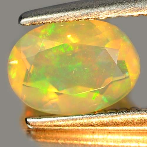 Natural Multi Color Play Of Colour Opal 0.56 Ct. Oval Shape 7.2 x 5.2 Mm Gemstone from Ethiopia (1 of 3)
