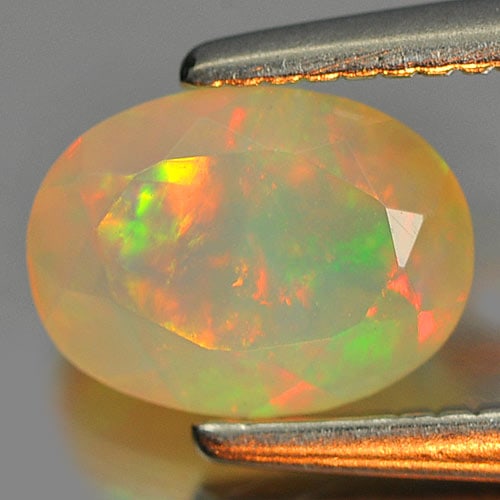 Natural Multi Color Play Of Colour Opal 0.68 Ct. Oval Shape 7 x 5.1 Mm Gemstone from Ethiopia (1 of 3)