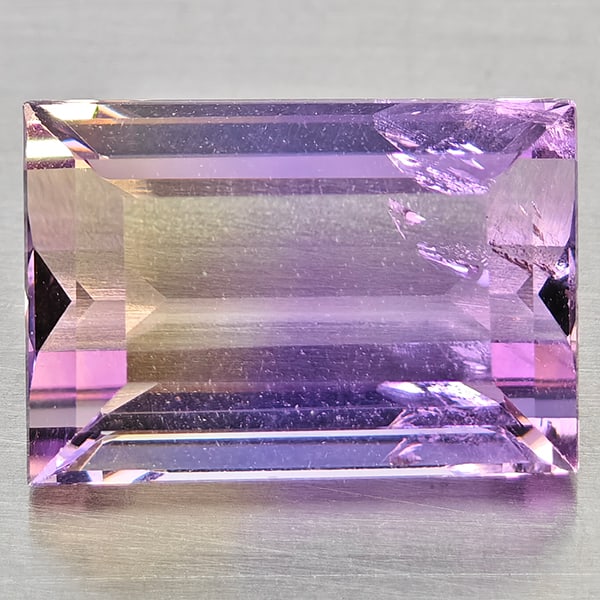 Natural Bi Color Ametrine 3.32 Ct. Baguette Shape 10.5 x 7.3 Mm Gemstone from Bolivia: Product ID: 800408513 Product Name: Natural Ametrine Weight: 3.32 CT. Size: 10.5 x 7.3 x 5.4 MM. Shape: Baguette Color: Bi Color Clarity:VSI Luster: Good Gems Origin: Bolivia Treatment: Unheated Cryst