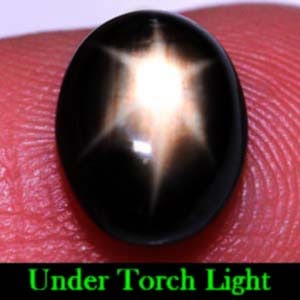 Natural Black Star Sapphire 2.56 Ct. Oval Cabochon Shape 8.5 x 6.7 Mm Gemstone From Thailand: Product ID: 806136101 Product Name: Natural Star Sapphire Weight: 2.56 CT. Size: 8.5 x 6.7 x 3.8 MM. Shape: Oval Cabochon Color: Black Clarity:Opaque Luster: Good 6 Rays Star Gems Origin: Thailand Tre