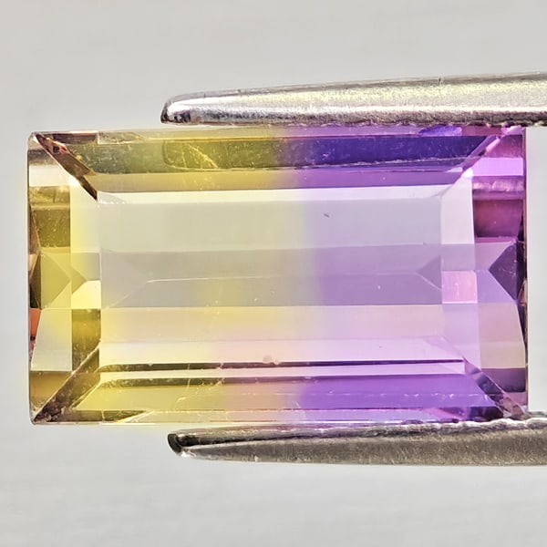 Natural Bi Color Ametrine 3.80 Ct. Baguette Shape 11.9 x 7.1 Mm Gemstone from Bolivia: Product ID: 800408281 Product Name: Natural Ametrine Weight: 3.80 CT. Size: 11.9 x 7.1 x 5.5 MM. Shape: Baguette Color: Bi Color Clarity:VSI Luster: Good Gems Origin: Bolivia Treatment: Unheated Cryst