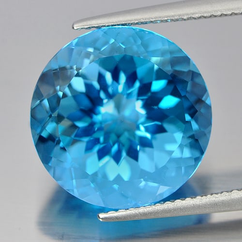 Natural Swiss Blue Topaz 15.72 Ct. Round Cornflower Cut 15 Mm Gemstone from Brazil: Product ID: 807166409 Product Name: Natural Blue Topaz Weight: 15.72 CT. Size: 15 x 15 x 10.4 MM. Shape: Round Cornflower Cut Color: Blue Clarity:IF Luster: Very Good Gems Origin: Brazil Treatment: Tr