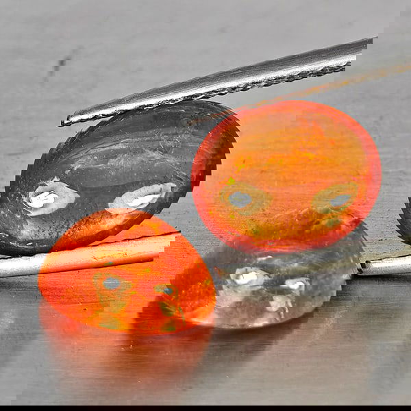 Natural Orangish Red Spessartine Garnet 5.33 Ct. 2 Pcs Oval Cabochon Shape Gemstones From Namibia: Product ID: 802937986 Product Name: Natural Garnet Weight: 5.33 CT. Size: 9 x 7.3 x 4.7 MM. Shape: Oval Cabochon Color: Orangish Red Clarity:SI1 Luster: Good Gems Origin: Namibia Treatment: Unheated C