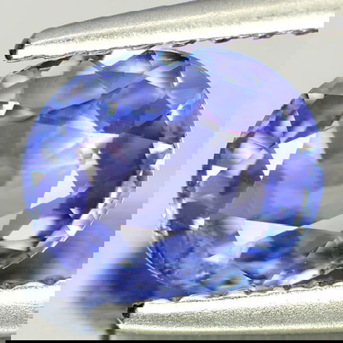 Natural Violet Blue Tanzanite 0.97 Ct Oval Shape 6.9 x 5.8 Mm Gemstone From Tanzania: Product ID: 807005535 Product Name: Natural Tanzanite Weight: 0.97 CT. Size: 6.9 x 5.8 x 3.2 MM. Shape: Oval Color: Purple Clarity:SI Luster: Good Gems Origin: Tanzania Treatment: Heated Crystal Struc