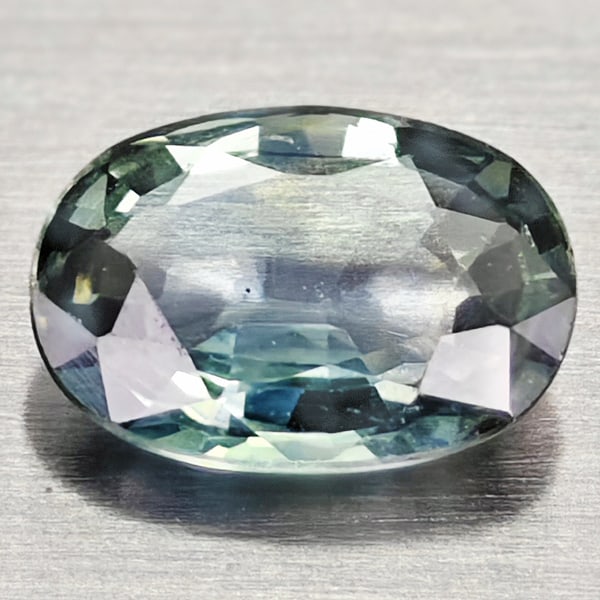 Natural Greenish Blue Sapphire 0.82 Ct. Oval Shape 7 x 5.1 Mm Gemstone From Madagascar: Product ID: 806162429 Product Name: Natural Green Sapphire Weight: 0.82 CT. Size: 7 x 5.1 x 2.4 MM. Shape: Oval Color: Greenish Blue Clarity:VSI Luster: Good Gems Origin: Madagascar Treatment: Heated