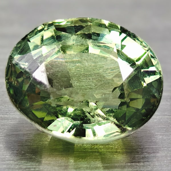 Natural Green Songea Sapphire 0.69 Ct. Oval Shape 5.3 x 4.4 Mm Gemstone from Tanzania (1 of 3)