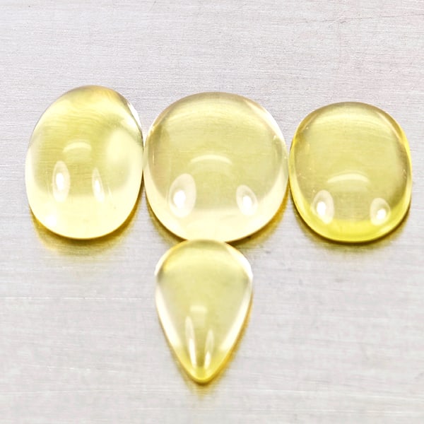 Natural Yellow Lemon Quartz 7.05 Ct. 4 Pcs Mixed Cabochon Shape Gemstones from Brazil: Product ID: 805530091 Product Name: Natural Quartz Weight: 7.05 CT. Size: 9.8 x 8.1 x 4.3 to 8.8 x 5.4 x 3.1 MM. Shape: Mixed Cabochon Color: Yellow Lemon Clarity:Semi - Transparent Luster: Good Gems