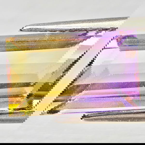 Natural Bi Color Ametrine 3.84 Ct. Octagon Shape 11.9 x 7.2 Mm Gemstone From Bolivia: Product ID: 800408416 Product Name: Natural Ametrine Weight: 3.84 CT. Size: 11.9 x 7.2 x 5.5 MM. Shape: Octagon Color: Bi Color Clarity:VSI - SI1 Luster: Good Gems Origin: Bolivia Treatment: Unheated