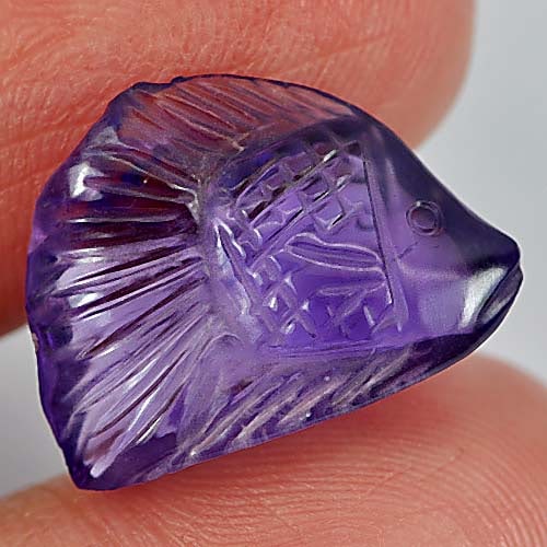 Natural Purple Amethyst 7.91 Ct. Fish Carving 17.3 x 13.2 Mm. Gemstone From Brazil: Product ID: 810302560 Product Name: Natural Amethyst Weight: 7.91 CT. Size: 17.3 x 13.2 x 6.3 MM. Shape: Fish Carving Color: Purple Clarity:Semi - Transparent Luster: Good Gems Origin: Brazil Treatmen