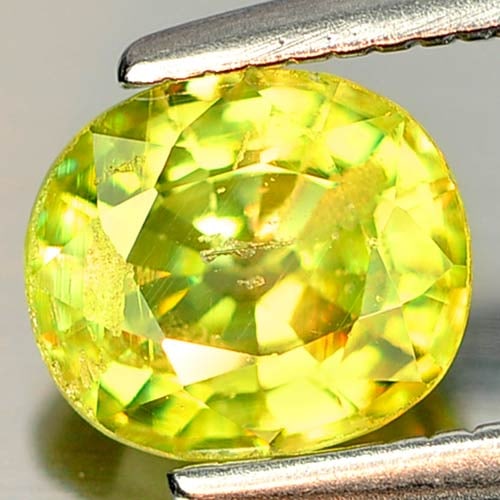 Natural Green Sphene 0.91 Ct. Oval Shape 6.4 x 5.7 Mm. Gemstone from Madagascar (1 of 3)