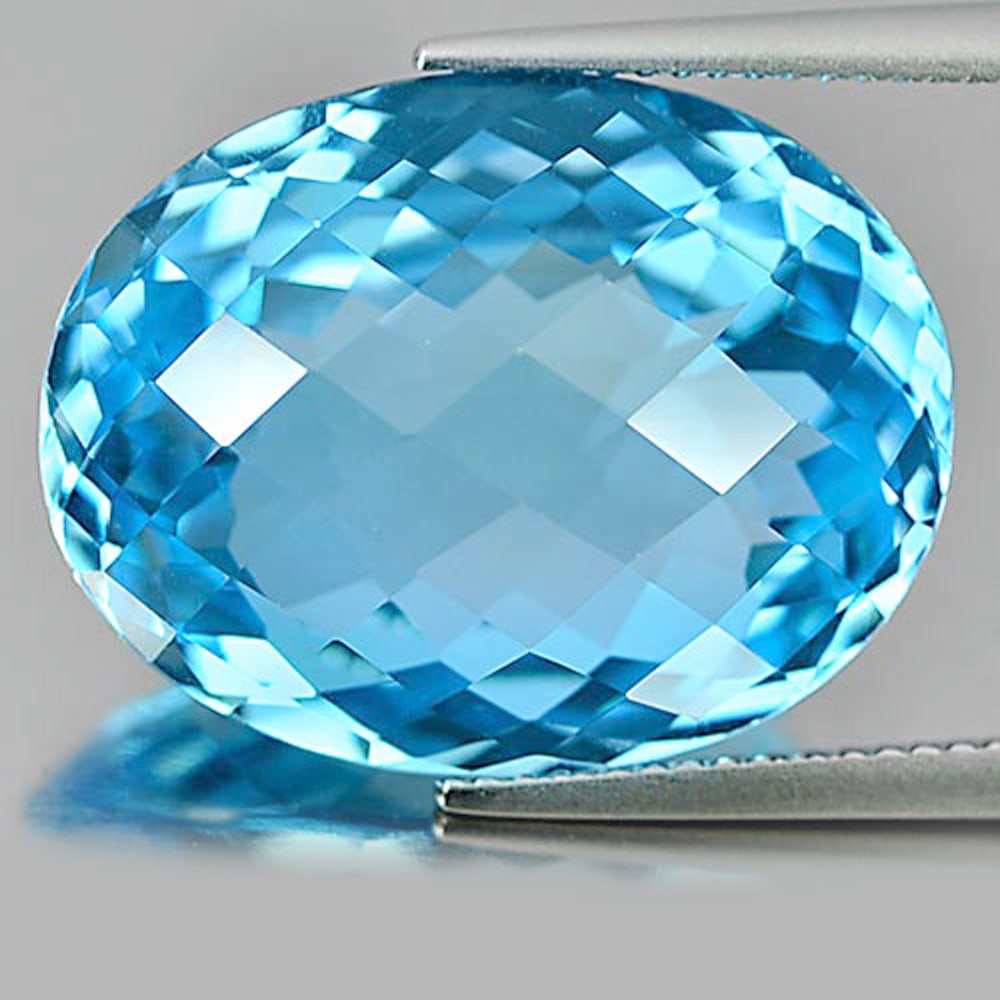 Swiss Blue Topaz 26.88 Ct. Clean Oval Checkerboard Cut 21 x 16.6 Mm. Gem: Product ID: 807158630 Product Name: Natural Blue Topaz Weight: 26.88 CT. Size: 21 x 16.6 x 10.1 MM. Shape: Oval Checkerboard Color: Blue Clarity:IF Luster: Very Good Gems Origin: Brazil Treatment: Tre