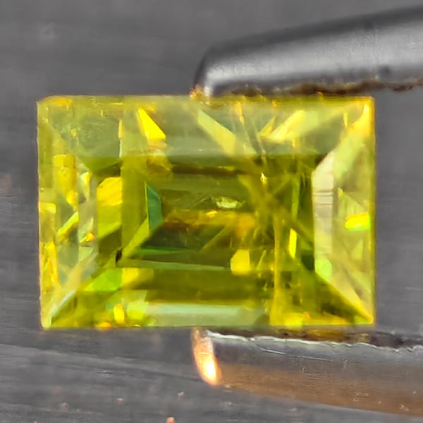 Natural Multi-Color With Rainbow Spark Sphene 0.43 Ct. Baguette Shape 4.8 x 3.3 Mm Gemstone From (1 of 3)