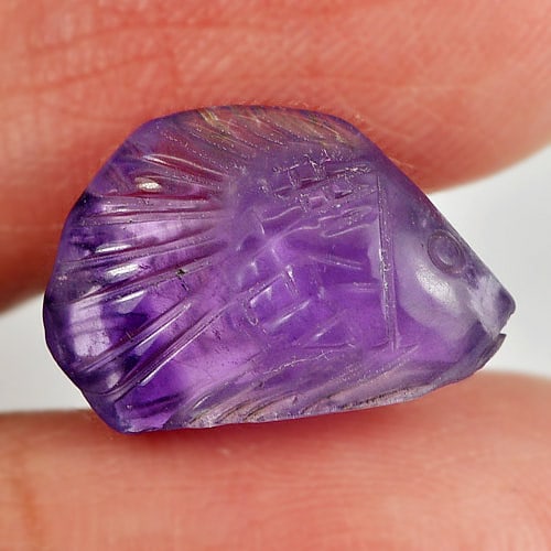 Natural Violet Amethyst 5.35 Ct. Fish Carving Shape 15.5 x 10.4 Mm Gemstone from Brazil: Product ID: 810303437 Product Name: Natural Amethyst Weight: 5.35 CT. Size: 15.5 x 10.4 x 6.1 MM. Shape: Fish Carving Color: Violet Clarity:Semi - Transparent Luster: Good Gems Origin: Brazil Treatmen
