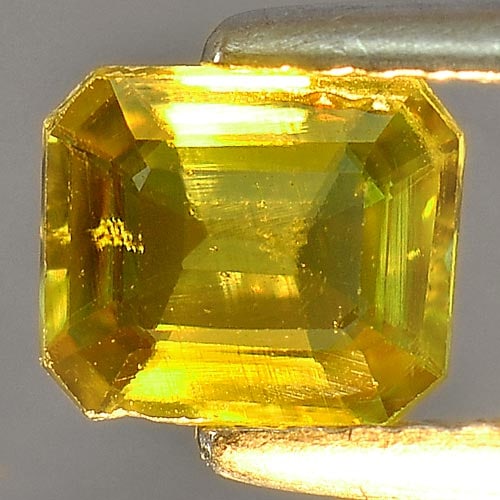 Natural Intense Green Titanium Red Spark Sphene 0.87 Ct. Octagon Shape 6.3 x 5.5 Mm. Gemstone from: Product ID: 806502776 Product Name: Natural Sphene Weight: 0.87 CT. Size: 6.3 x 5.5 x 2.6 MM. Shape: Octagon Color: Intense Green With Red Spark Clarity:VSI Luster: Adamantine Gems Origin: Madagascar