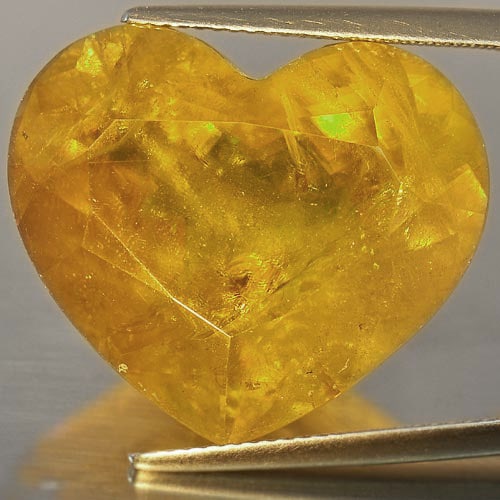 Natural Multi Color Sphene Red Spark 35.99 ct. Heart Shape 20.4 x 20.1 Mm. Gemstone From Madagascar: Product ID: 806500585 Product Name: Natural Sphene Weight: 35.99 CT. Size: 20.4 x 20.1 x 10.3 MM. Shape: Heart Color: Multi Color Clarity:SI Luster: Adamantine Gems Origin: Madagascar Treatment: Unhea