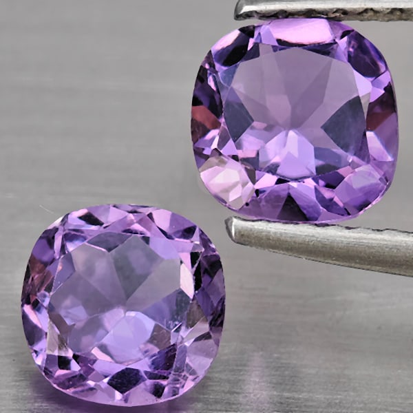 Natural Purple Amethyst 1.70 Ct. 2 Pcs. Cushion Shape 6.3 Mm. Gemstone From Brazil: Product ID: 800325573 Product Name: Natural Amethyst Weight: 1.70 CT. Size: 6.3 x 6.3 x 4.1 MM. Shape: Cushion Shape Color: Purple Clarity:VSI Luster: Very Good Gems Origin: Brazil Treatment: Unheated