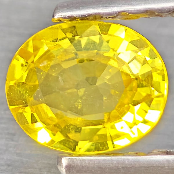 Natural Yellow Sapphire 0.51 Ct. Oval Shape 5.2 x 4.2 Mm Gemstone from Thailand: Product ID: 806162845 Product Name: Natural White Gold Weight: 0.51 CT. Size: 5.2 x 4.2 x 2.5 MM. Shape: Oval Shape Color: Yellow Clarity:VSI Luster: Good Gems Origin: Thailand Treatment: Heated Cryst
