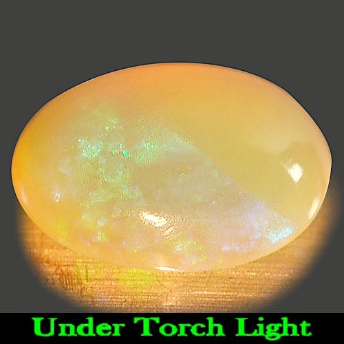 Natural Multi Color Play Of Colour Opal 0.93 Ct. Oval Cabochon Shape 9 x 6.9 Mm Gemstone from: Product ID: 818725209 Product Name: Natural Opal Weight: 0.93 CT. Size: 9 x 6.9 x 3.5 MM. Shape: Oval Cabochon Color: Multi Color Clarity:Semi - Transparent Luster: Iridescent Gems Origin: Ethiopia Tr