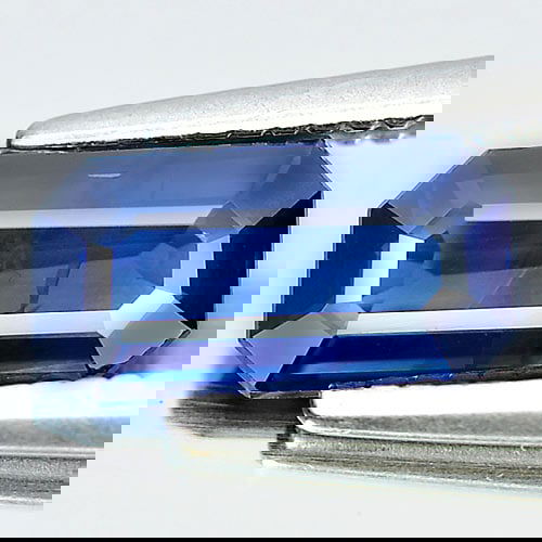 Natural Blue Sapphire 0.94 Ct. Octagon Shape 8.5 x 4.5 Mm. Gemstone from Thailand: Product ID: 806007205 Product Name: Natural Blue Sapphire Weight: 0.94 CT. Size: 8.5 x 4.5 x 2.3 MM. Shape: Octagon Color: Blue Clarity:VSI Luster: Good Gems Origin: Thailand Treatment: Heated Crystal