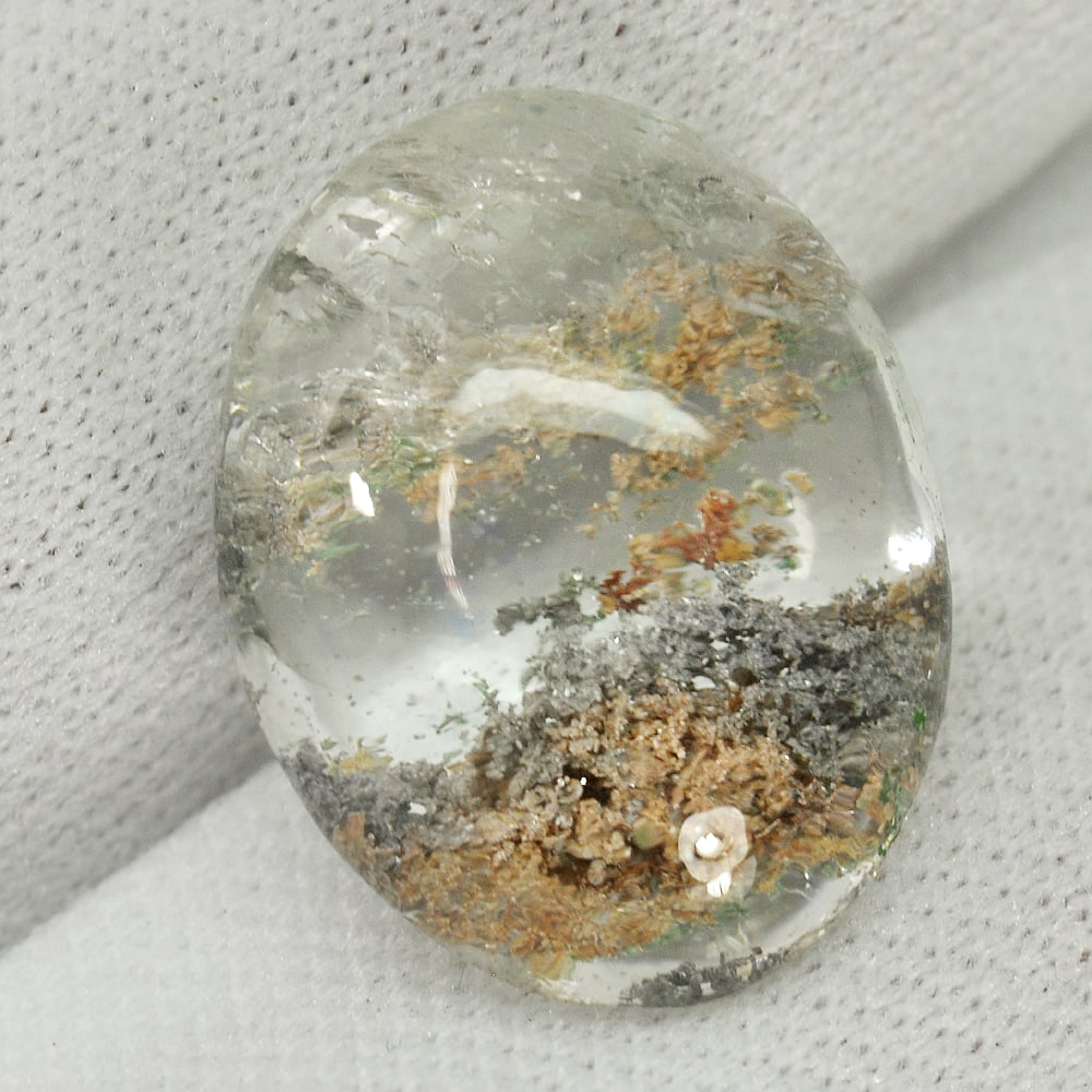 Natural White Brown Moss Quartz 15.14 Ct. Oval Cabochon Shape 18.5 x 14.4 Mm Gemstone from Thailand: Product ID: 805529509 Product Name: Natural Quartz Weight: 15.14 CT. Size: 18.5 x 14.4 x 8.7 MM. Shape: Oval Cabochon Color: White Clarity:Semi - Transparent Luster: Good Gems Origin: Thailand Treatme
