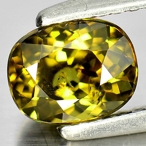 Natural Greenish Yellow Demantoid Garnet 1.42 Ct. Oval Shape 6.9 x 5.5 Mm. Gemstone From Madagascar: Product ID: 802931363 Product Name: Natural Demantoid Weight: 1.42 CT. Size: 6.9 x 5.5 x 4.2 MM. Shape: Oval Color: Greenish Yellow Clarity:SI1 Luster: Very Good Gems Origin: Madagascar Treatment: Unh
