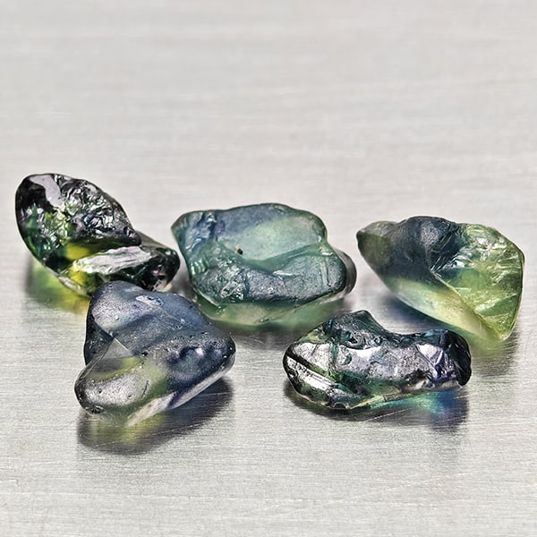 Natural Unheated Greenish Blue Sapphire 4.98 Ct. 5 Pcs Rough Shape Gemstones from Madagascar: Product ID: 806162533 Product Name: Natural Green Sapphire Weight: 4.98 CT. Size: 7.2 x 4.6 x 2.8 to 7.8 x 4.2 x 4.1 MM. Shape: Rough Mixed Shape Color: Greenish Blue Clarity:VSI Luster: Good Gems Ori