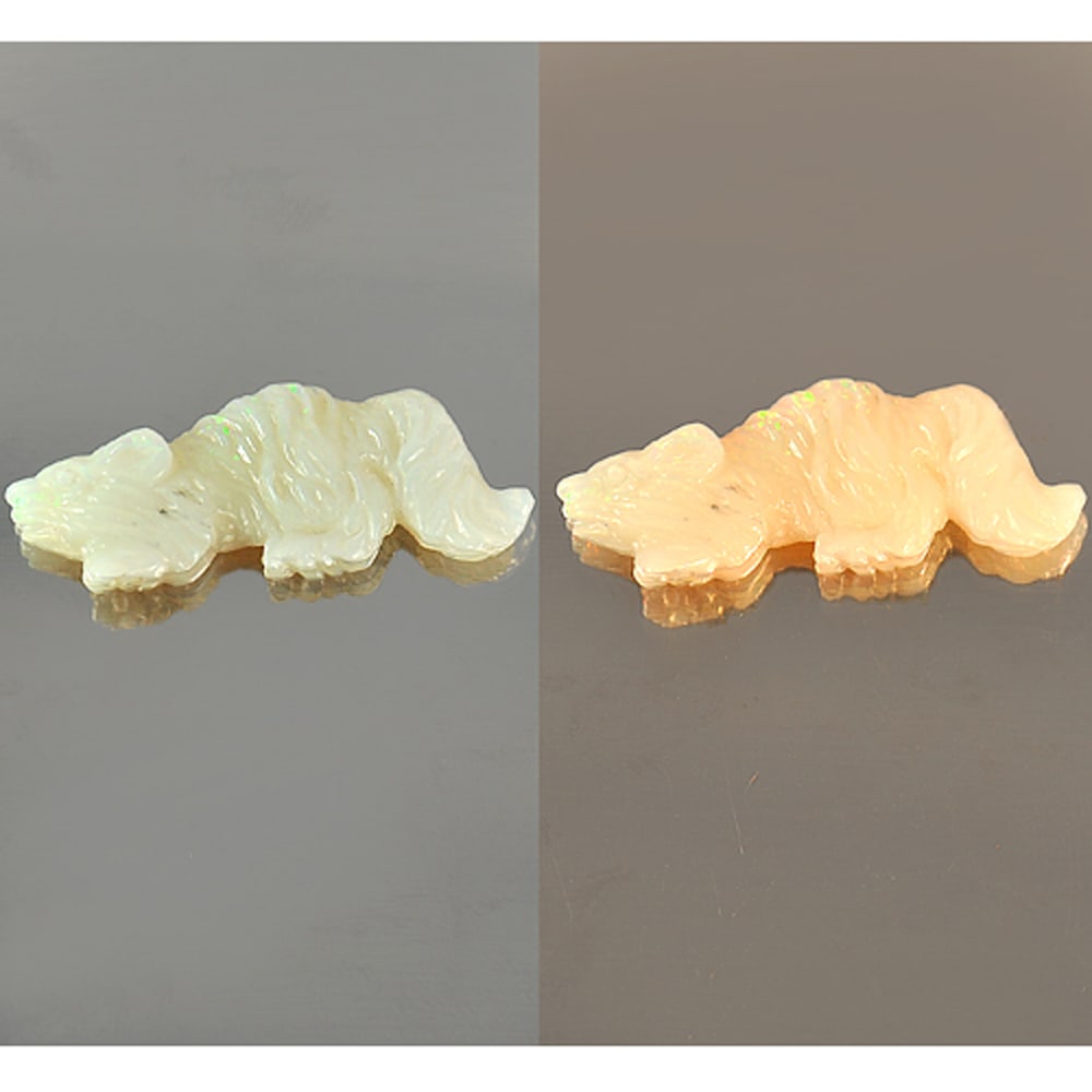 Natural Multi Color Opal 8.74 Ct. Squirrel Carving Shape 30 x 11 Mm. Gemstone from Australia: Product ID: 818722514 Product Name: Natural Opal Carving Weight: 8.74 CT. Size: 30 x 11 x 6 MM. Shape: Squirrel Carving Color: Multi Color Clarity:Semi - Transparent Luster: Strong Iridescent Gems Ori