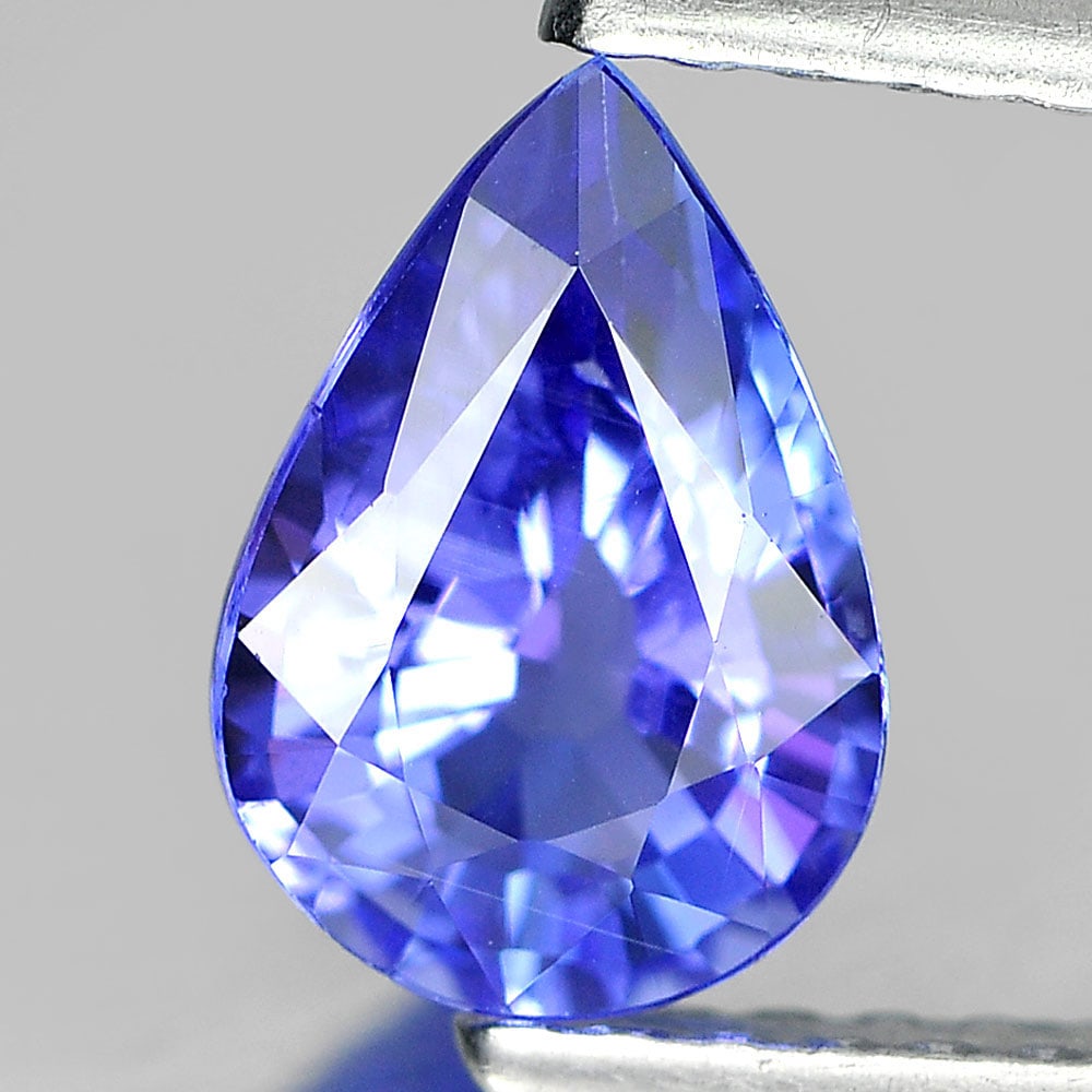 Natural Violetish Blue Tanzanite 0.99 Ct. Pear Shape 8 x 5.6 Mm Gemstone From Tanzania: Product ID: 807006113 Product Name: Natural Tanzanite Weight: 0.99 CT. Size: 8 x 5.6 x 3.7 MM. Shape: Pear Color: Blue Clarity:SI1 Luster: Good Gems Origin: Tanzania Treatment: Heated Crystal Structur