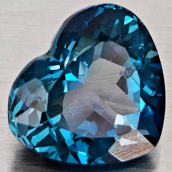 Natural London Blue Topaz 5.22 Ct. Heart Shape 11 x 9.7 Mm. Gemstone From Brazil: Product ID: 807168357 Product Name: Natural Blue Topaz Weight: 5.22 CT. Size: 11 x 9.7 x 6.9 MM. Shape: Heart Shape Color: London Blue Clarity:VSI Luster: Very Good Gems Origin: Brazil Treatment: Trea
