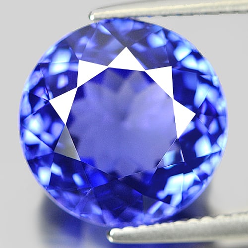 Natural Violetish Blue Tanzanite 9.04 Ct. Round Shape 12.42 x 12.48 Mm Gemstone from Tanzania: Product ID: 807004445 Product Name: Natural Tanzanite Weight: 9.04 CT. Size: 12.42 - 12.48 x 7.92 MM. Shape: Round Color: Blue Clarity:IF Luster: Very Good Gems Origin: Tanzania Treatment: Heated Crys