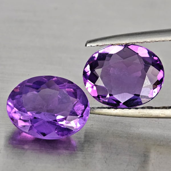 Natural Purple Amethyst 4.44 Ct. 2 Pcs Oval Shape 10 x 8.2 Mm Gemstone From Brazil: Product ID: 800325715 Product Name: Natural Amethyst Weight: 4.44 CT. Size: 10 x 8.2 x 4 MM. Shape: Oval Shape Color: Purple Clarity:VSI Luster: Good Gems Origin: Brazil Treatment: Unheated Crystal St