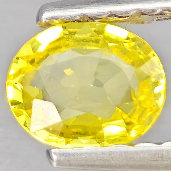 Natural Yellow Sapphire 0.46 Ct. Oval Shape 5.1 x 4.1 Mm Gemstones From Thailand: Product ID: 806162775 Product Name: Natural Yellow Sapphire Weight: 0.46 CT. Size: 5.1 x 4.1 x 2.2 MM. Shape: Oval Shape Color: Yellow Clarity:VSI Luster: Good Gems Origin: Thailand Treatment: Heated