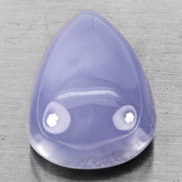 Natural Lavender Chalcedony 50.69 Ct. Pear Cabochon Shape 29 x 19 Mm Gemstone From Russia: Product ID: 801502651 Product Name: Natural Chalcedony Weight: 50.69 CT. Size: 29 x 19 x 13.7 MM. Shape: Pear Cabochon Color: Lavender Clarity:Semi - Transparent Luster: Good Gems Origin: Russia Treat