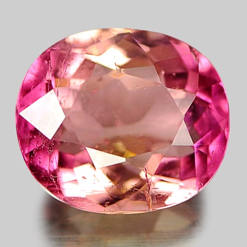 Natural Purplish Pink Tourmaline 0.79 Ct. Oval Shape 6.2 x 5.4 Mm Gemstone from Nigeria: Product ID: 807246857 Product Name: Natural Tourmaline Weight: 0.79 CT. Size: 6.2 x 5.4 x 3.3 MM. Shape: Oval Color: Pink Clarity:VSI Luster: Good Gems Origin: Nigeria Treatment: Unheated Crystal Stru