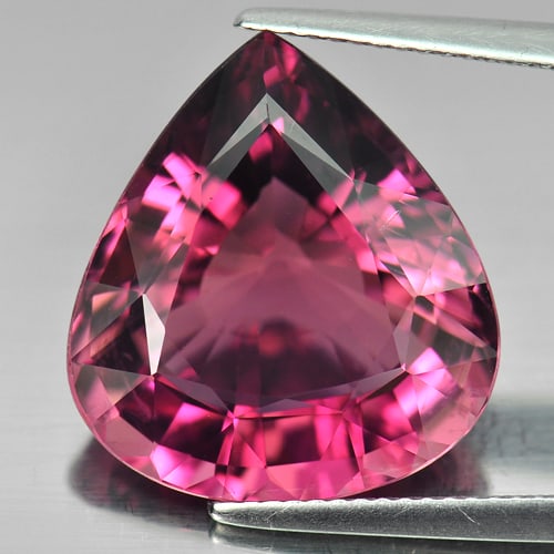 Certified Natural Purplish Pink Tourmaline 14.30 Ct. Pear Shape 16.69 x 18.22 Mm Gemstone from: Product ID: 807239684 Product Name: Natural Tourmaline Weight: 14.30 CT. Size: 16.69 x 18.22 x 8.56 MM. Shape: Pear Color: Purplish Pink Clarity:IF Luster: Very Good Gems Origin: Nigeria Treatment: Un