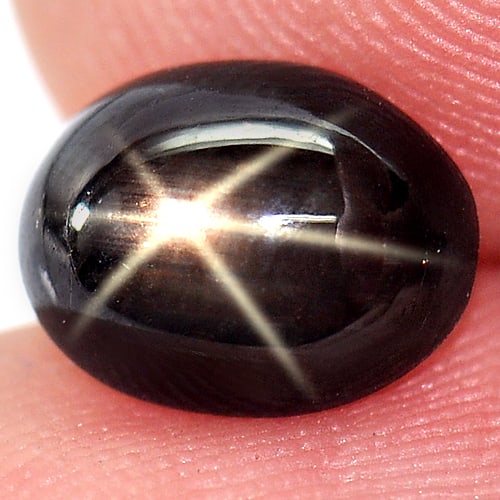 Natural Black Star Sapphire 1.95 Ct. Oval Cabochon Shape 8.3 x 6.5 Mm Gemstone from Thailand: Product ID: 806138491 Product Name: Natural Star Sapphire Weight: 1.95 CT. Size: 8.3 x 6.5 x 3.6 MM. Shape: Oval Cabochon Color: Black Clarity:Opaque Luster: Good 6 Rays Star Gems Origin: Thailand Tre
