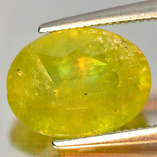 Natural Intense Green Titanium Red Spark Sphene 4.85 Ct. Oval Shape 11.6 x 8.8 Mm Gemstone from (1 of 3)