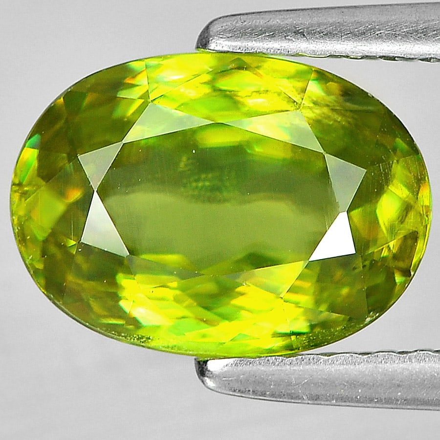 Natural Yellowish Green Titanium With Rainbow Spark Sphene 2.32 Ct. Oval Shape 9.5 x 6.9 Mm Gemstone: Product ID: 806505400 Product Name: Natural Sphene Weight: 2.32 CT. Size: 9.5 x 6.9 x 4.3 MM. Shape: Oval Color: Yellowish Green With Rainbow Spark Clarity:VSI Luster: Adamantine Gems Origin: Madagasc