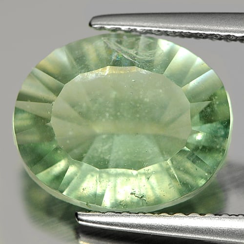 Natural Green Fluorite Unheated 4.66 Ct. Oval Concave Cut 12.1 x 10.1 Mm. Unheated Gemstone From: Product ID: 802704888 Product Name: Natural Fluorite Weight: 4.66 CT. Size: 12.1 x 10.1 x 5.6 MM. Shape: Oval Concave Cut Color: Green Clarity:SI1 Luster: Good Gems Origin: Brazil Treatment: Unheated