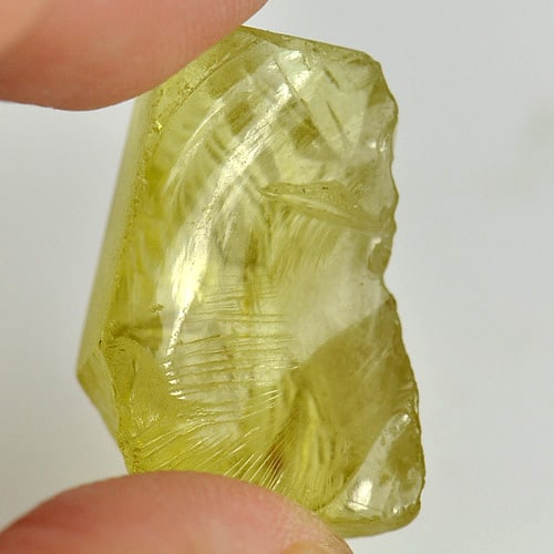 Natural Yellow Quartz 26.86 Ct. Rough Shape 25 x 14.8 Mm. Gemstone from Brazil: Product ID: 805523921 Product Name: Natural Rough Weight: 26.86 CT. Size: 25 x 14.8 x 12.8 MM. Shape: Rough Color: Yellow Clarity:Semi - Transparent Luster: Good Gems Origin: Brazil Treatment: Unheate