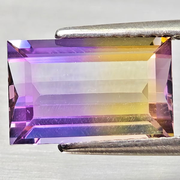 Natural Bi Color Ametrine 3.05 Ct. Octagon Shape 11.1 x 7.1 Mm Gemstone from Bolivia: Product ID: 800408380 Product Name: Natural Ametrine Weight: 3.05 CT. Size: 11.1 x 7.1 x 4.9 MM. Shape: Octagon Color: Bi Color Clarity:VSI Luster: Good Gems Origin: Bolivia Treatment: Unheated Crysta