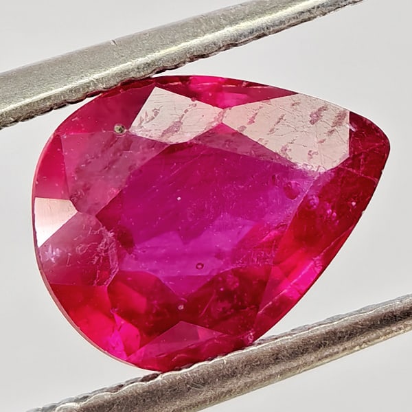 Natural Purplish Red Ruby 2.11 Ct. Pear Shape 9.1 x 7.1 Mm Gemstone from Madagascar: Product ID: 805935511 Product Name: Natural Ruby Weight: 2.11 CT. Size: 9.1 x 7.1 x 4 MM. Shape: Pear Shape Color: Purplish Pink Clarity:VSI - SI1 Luster: Good Gems Origin: Madagascar Treatment: Heate
